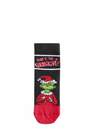 Mustad mustad mustad mustad mustad mustad mustad mustad mustad mustad, millel on roheline Grinchi disain, punased aktsendid ja tekst "ÄRA OLE GRINCH!" valgel, kontrastse punase varbaga.