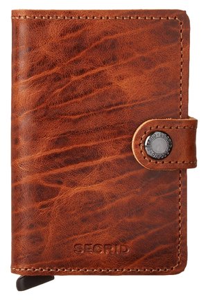 Brown leather wallet with a textured surface, snap closure, and embossed logo. Features a card slot and slim design.