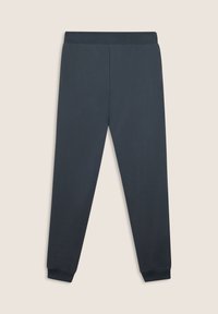Pantaloni della tuta navy in tessuto morbido, con una vestibilità affusolata, vita elasticizzata e polsini alle caviglie. Nessun motivo o decorazione.