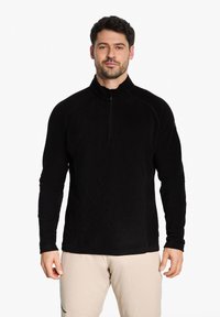 Schwarzer Fleece-Pullover mit einem Viertelreißverschluss, langen Ärmeln und hohem Kragen. Weicher Textur mit einer taillierten Passform und dezenten Nähten.