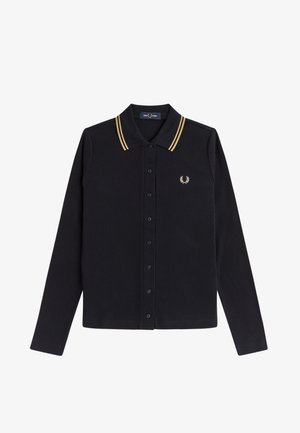 Camisa negra de manga larga acanalada con botones, con doble raya dorada en el cuello y un pequeño logo de corona de laurel dorada en el pecho.