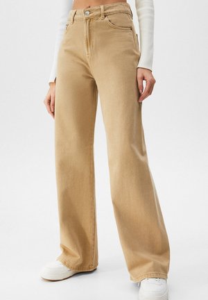Flared jeans - mottled beige