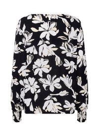 Blouse noire avec un motif floral blanc, manches longues avec des poignets smockés et une simple fermeture à bouton au dos.