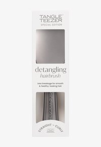 Szczotka do rozczesywania Tangle Teezer w eleganckim, srebrnym wykończeniu. Ergonomiczny kształt, trwały plastik i lekka konstrukcja ułatwiająca użycie.