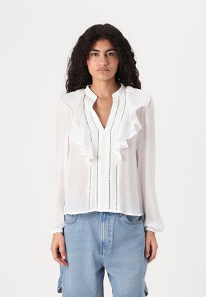 White blouse with ruffled collar, pinstriped detailing, and long sleeves. Made from lightweight fabric, featuring buttons along the front.