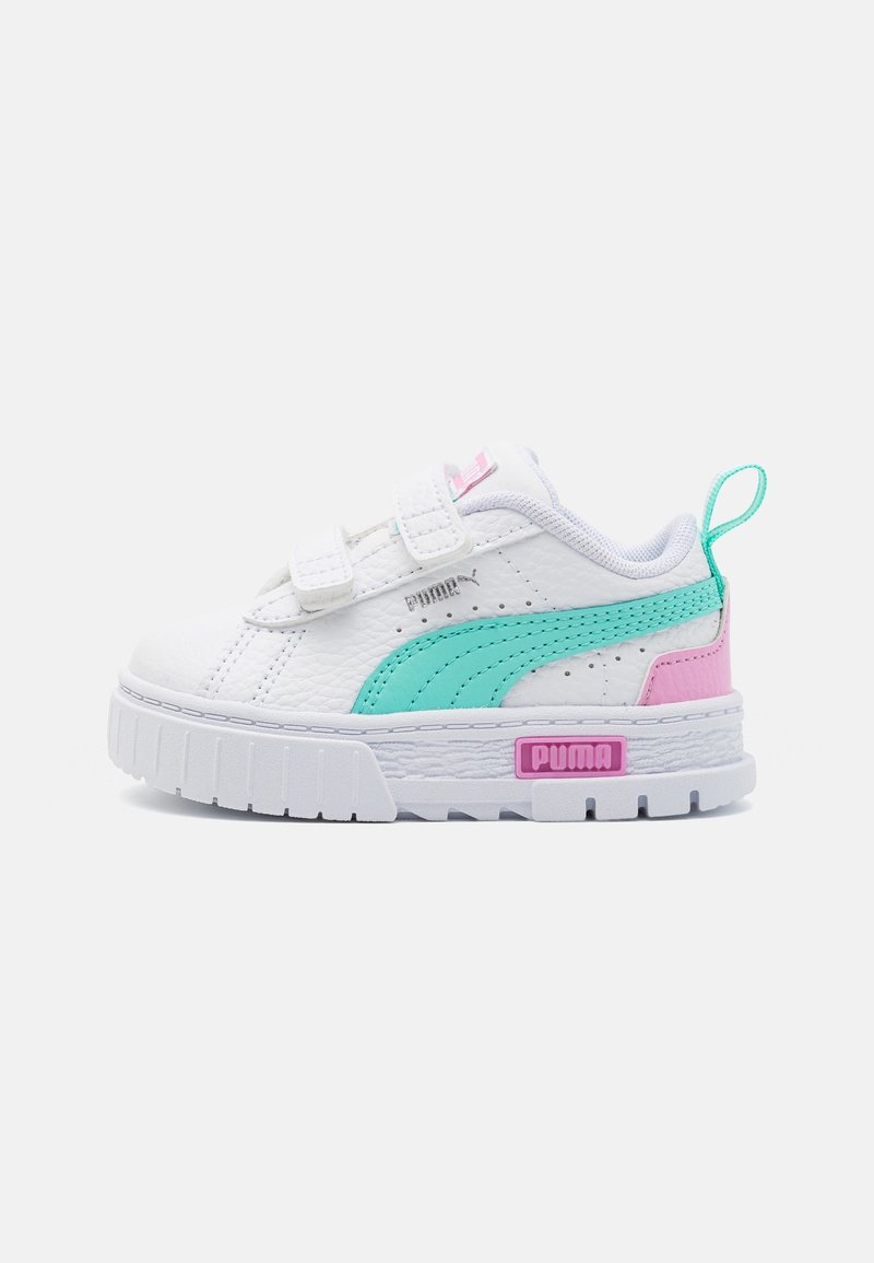 White leather sneakers with aqua and pink accents, featuring a hook-and-loop strap, a chunky white sole, and a raised logo.