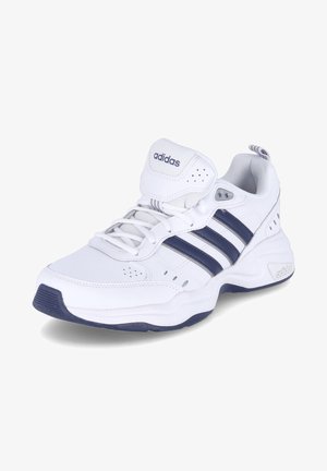 White athletic shoe with navy blue accents, featuring three stripes, a padded collar, mesh panels, and a textured rubber sole.