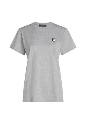 Graues Baumwoll-T-Shirt mit kurzen Ärmeln, Rundhalsausschnitt und einem kleinen schwarzen Logo auf der linken Brustseite. Einfaches Design und entspannte Passform.