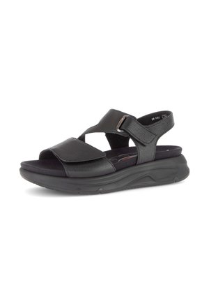 Zwarte leren sandalen met zachte kussentjes, verstelbare bandjes en een dikke, gestructureerde zool, ontworpen voor comfort en ondersteuning.