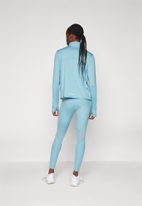 Nike Performance FAST - Leggings da corsa lunghi - denim turquoise/silver