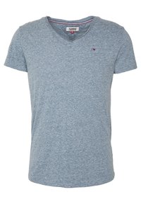 Blå melerad kortärmad t-shirt med V-hals, tillverkad av mjuk bomull. Innehåller en liten logotyp på bröstet. Sömmen är synlig längs kanterna.