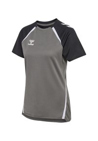 T-shirt de sport gris avec des manches raglan noires et des accents blancs. Doté d'un tissu texturé et du logo Hummel sur le devant.