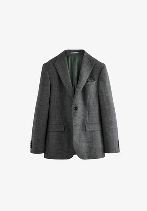 Blazer texturé gris avec une fermeture à un bouton, des revers crantés, deux poches avant et une doublure intérieure verte. Comprend un mouchoir de poche.
