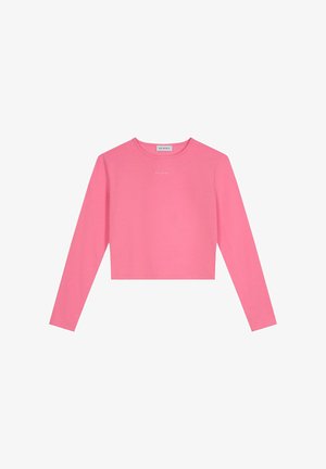 Dolgimi rokavi, krajša majica v svetlo rožnati bombažni tkanini. Ima okroglo ovratnico in majhen beli logotip na prsih. Mehka, gladka tekstura.