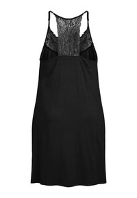 Camisole nera con un design di pizzo sulla schiena, spalline regolabili e una texture liscia. La forma complessiva è ampia e rilassata.
