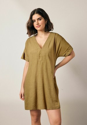 Olive green linen dress with a V-neck, short sleeves, and a loose fit, featuring a small front placket and soft texture.