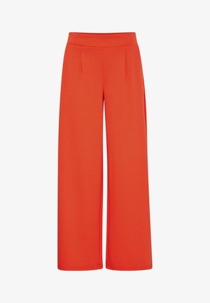 Weite Hosen aus leuchtend orangefarbenem Stoff, mit einer glatten Textur, elastischem Taillenbund und zwei vorderen Falten für zusätzlichen Detail.