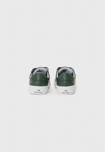 Green leather sneakers with a white sole, featuring a prominent back tab and "PS Paul Smith" logo near the heel, smooth texture.
