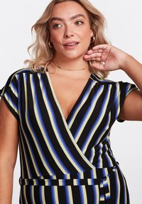 Black wrap dress with vertical blue, yellow, and white stripes. Features short sleeves, deep V-neck, and a tie waist detail. Soft, stretchy fabric.