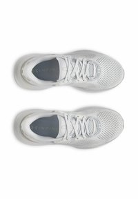 White athletic shoes with a mesh upper, flat laces, and cushioned soles. Features a textured pattern and logo on the side.