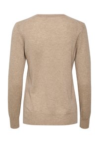 Pull beige à manches longues, col rond et texture douce et lisse. Présente des poignets et un ourlet côtelés, design minimal, sans motifs.