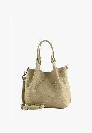 Sac à main en cuir texturé beige avec deux poignées et une bandoulière ajustable, présenté sur un fond blanc uni.