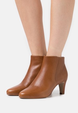 Minelli, Boots à talons - tan