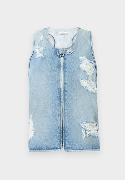 Sleeveless denim vest in light blue, featuring distressed patches, a zipper front closure, and rounded neckline. Textured, casual style.