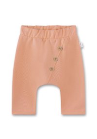 Pfirsichfarbene Babyhose aus weichem Stoff, mit einem breiten elastischen Bund und drei dekorativen Holzknöpfen an der Seite.