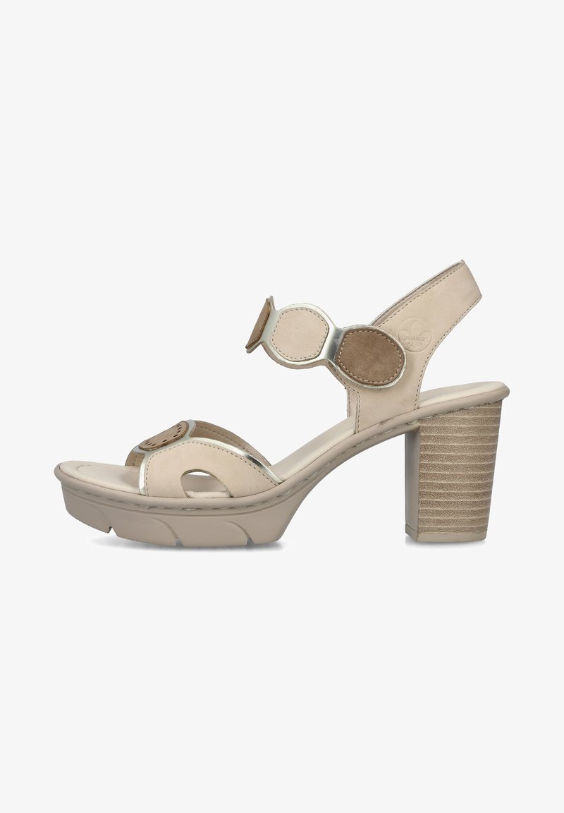 Sandale beige à bout ouvert, talon bloc, bride à la cheville, patchs décoratifs circulaires et semelle rembourrée.