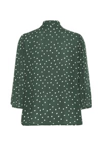 Blusa verde con una consistenza morbida, caratterizzata da pois bianchi, vestibilità ampia e maniche a tre quarti. Dettaglio del collo a cappotto sul retro.