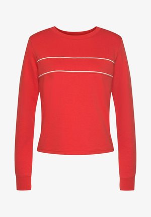 Red long-sleeve top made of cotton with a rounded neckline, featuring two horizontal white stripes across the chest and ribbed cuffs.