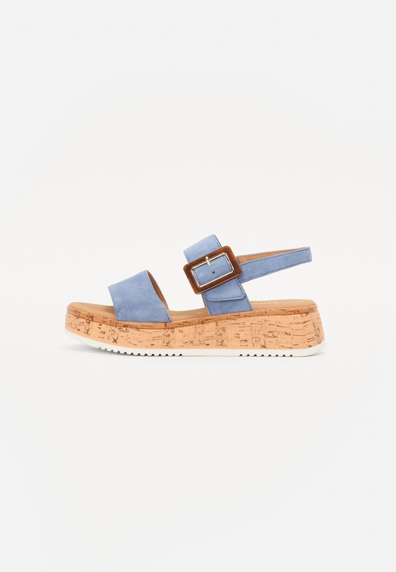 Sandali blu in suede con suola in sughero, dotati di una cinturino regolabile con fibbia e una superficie texturizzata.