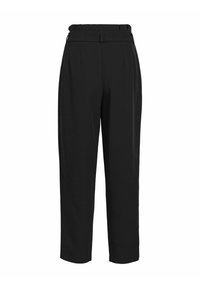 Pantalons noirs cintrés à taille haute, présentant une texture lisse, des plis et une ceinture élastique discrète pour le confort.