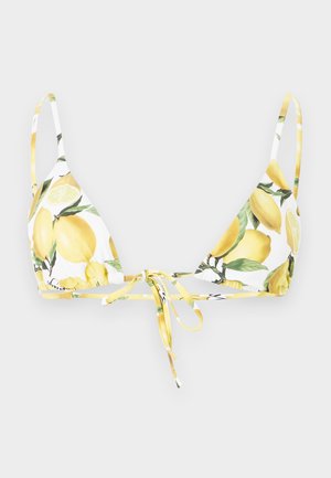 Hvid bikinitop med gul citron- og grønt bladmønster, med tynde stropper og bindelukning foran.