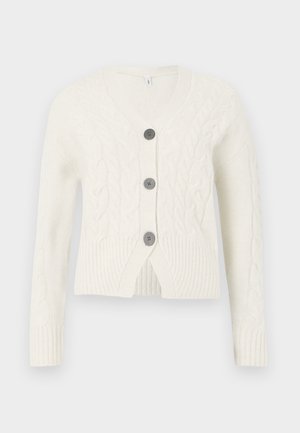 Bijela pletena kardigan s V-izrezom, ukrašen kabel uzorkom, tri tamna gumba i rebrastim manžetama i rubovima. Skraćena duljina.