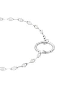 Silver metal chain necklace featuring oval links and a circular clasp. Smooth texture with shiny finish and minimalist design.