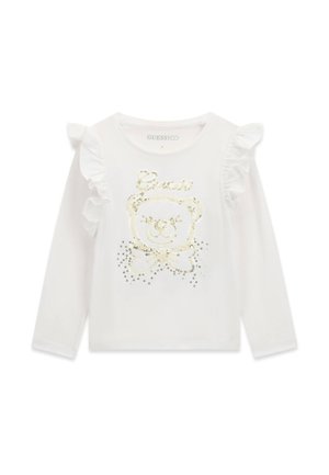 T-shirt blanc à manches longues pour tout-petit avec épaules à volants et motif ours en sequins dorés sur le devant.