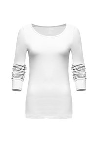 Camicia bianca a maniche lunghe slim-fit con maniche arricciate e scollatura rotonda, esposta su uno sfondo semplice.