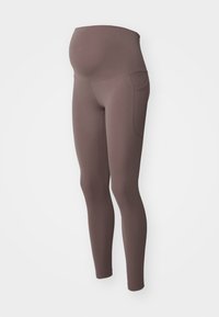 Legginsy ciążowe w stonowanym brązie z wysokim, elastycznym pasem, zaprojektowane do zakrywania brzuszka w ciąży, z bocznymi kieszeniami i zwężanymi nogawkami.
