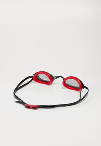Red swim goggles with a black strap, featuring a flexible rubber seal around the lenses and a simple adjustable clasp at the back.