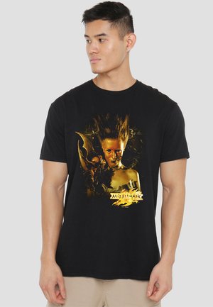 Black cotton t-shirt featuring a graphic print of a character with golden skin and dramatic hair, surrounded by intricate designs.