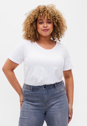 White short-sleeve v-neck t-shirt made of soft material, paired with high-waisted gray denim jeans featuring front pockets and a button closure.