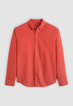 Long-sleeved button-up shirt made of cotton in a coral color, featuring a classic collar and a small logo on the chest.