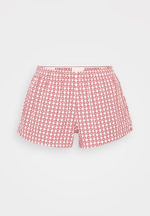Røde og hvite rutete boxershorts med myk elastisk linning med "Hollister"-logo. Laget av lett stoff.