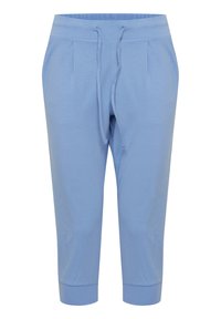 Světle modré, po kolena dlouhé jogger kalhoty vyrobené z měkké bavlněné tkaniny. Mají elastický pas s šňůrkou a žebrované manžety.