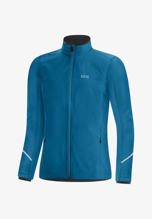 Blauwe sportjas met volledige ritssluiting, hoge kraag, twee met rits afsluitbare zijzakken, reflecterende strepen op de mouwen en klein "GORE"-logo op de borst.