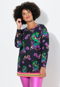Tunic a maniche lunghe in cotone nero con vivaci motivi di draghi e fiori, scollatura rotonda e orlo a righe multicolori.