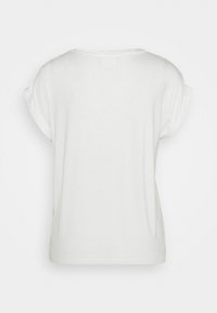 T-shirt blanc pour femme à manches courtes avec revers sur les manches, col rond et coupe ample, présenté de dos sur un fond uni.