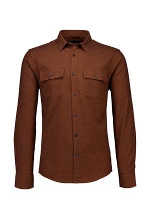 Bruine lange mouw shirt van geweven stof. Heeft een button-down kraag, twee borstzakken en donkergekleurde knopen aan de voorkant.